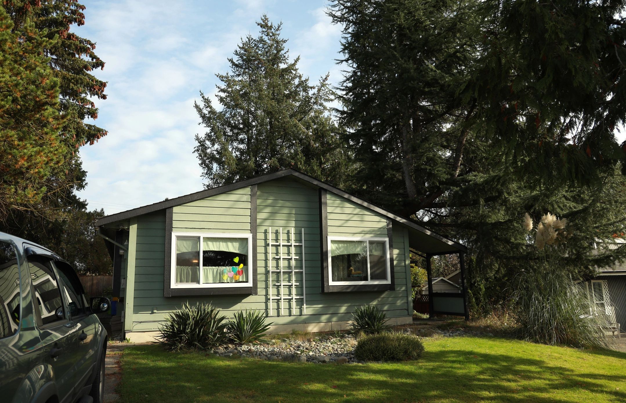 Custom impact window replacement on a residential home exterior