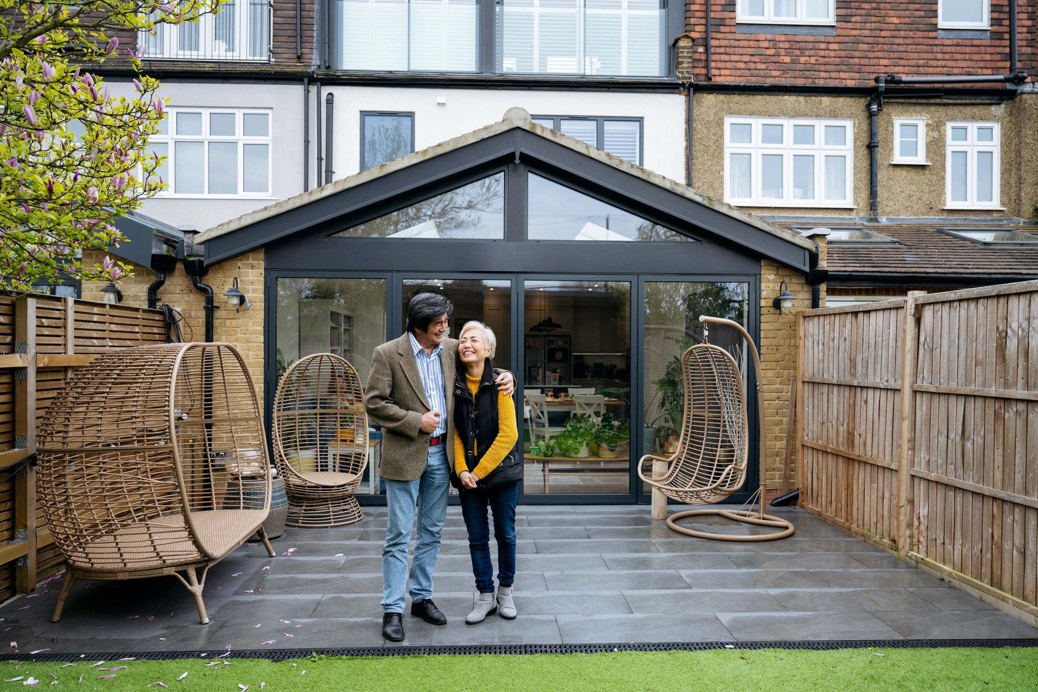 Happy homeowners enjoying a bright patio area