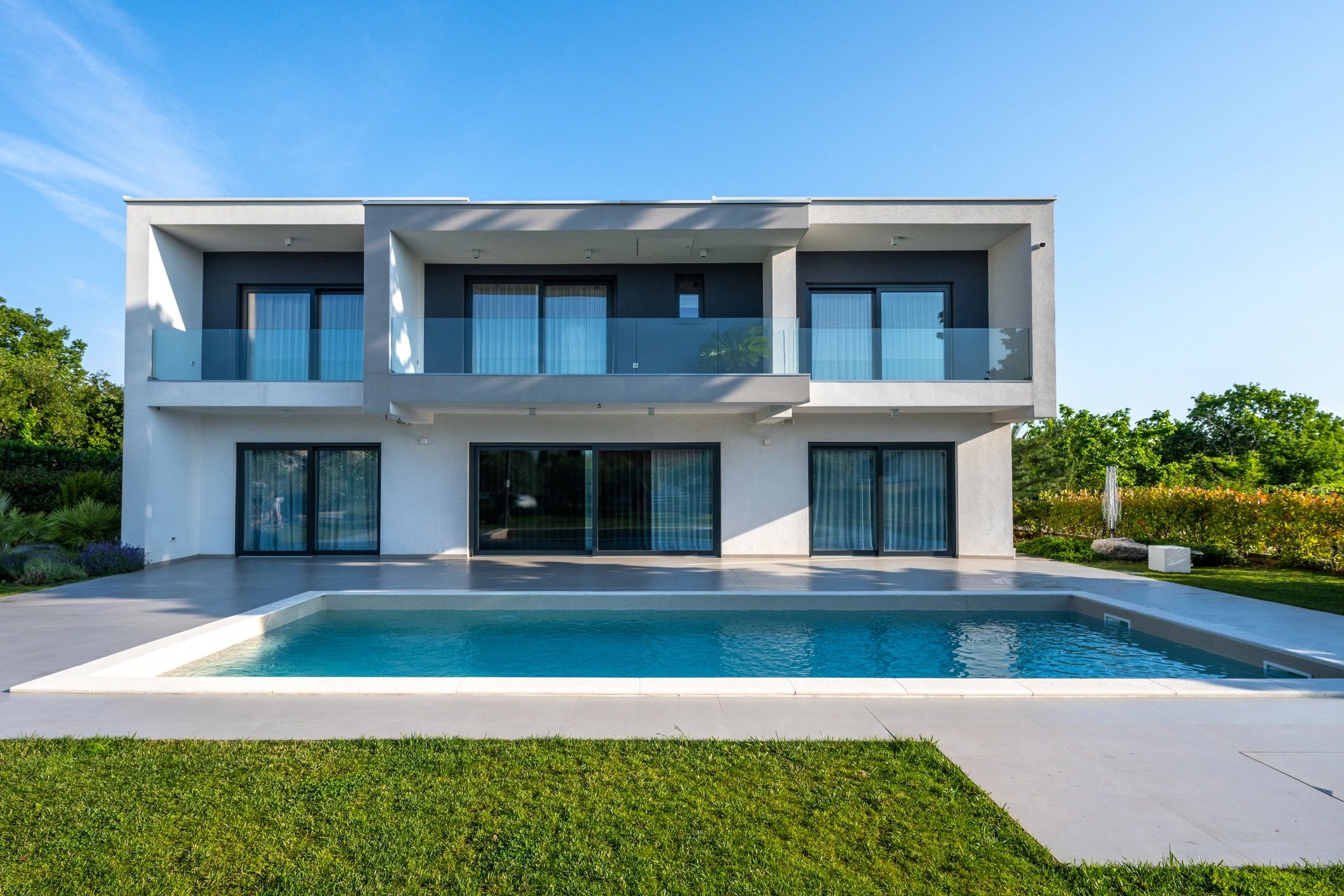 Single hung impact windows on a modern home exterior