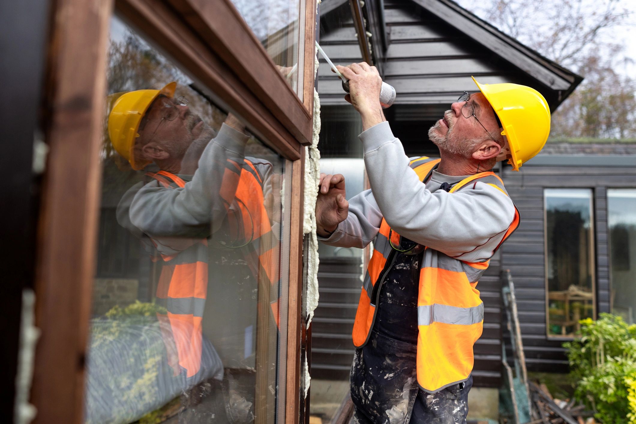 Technician working on residential window installation