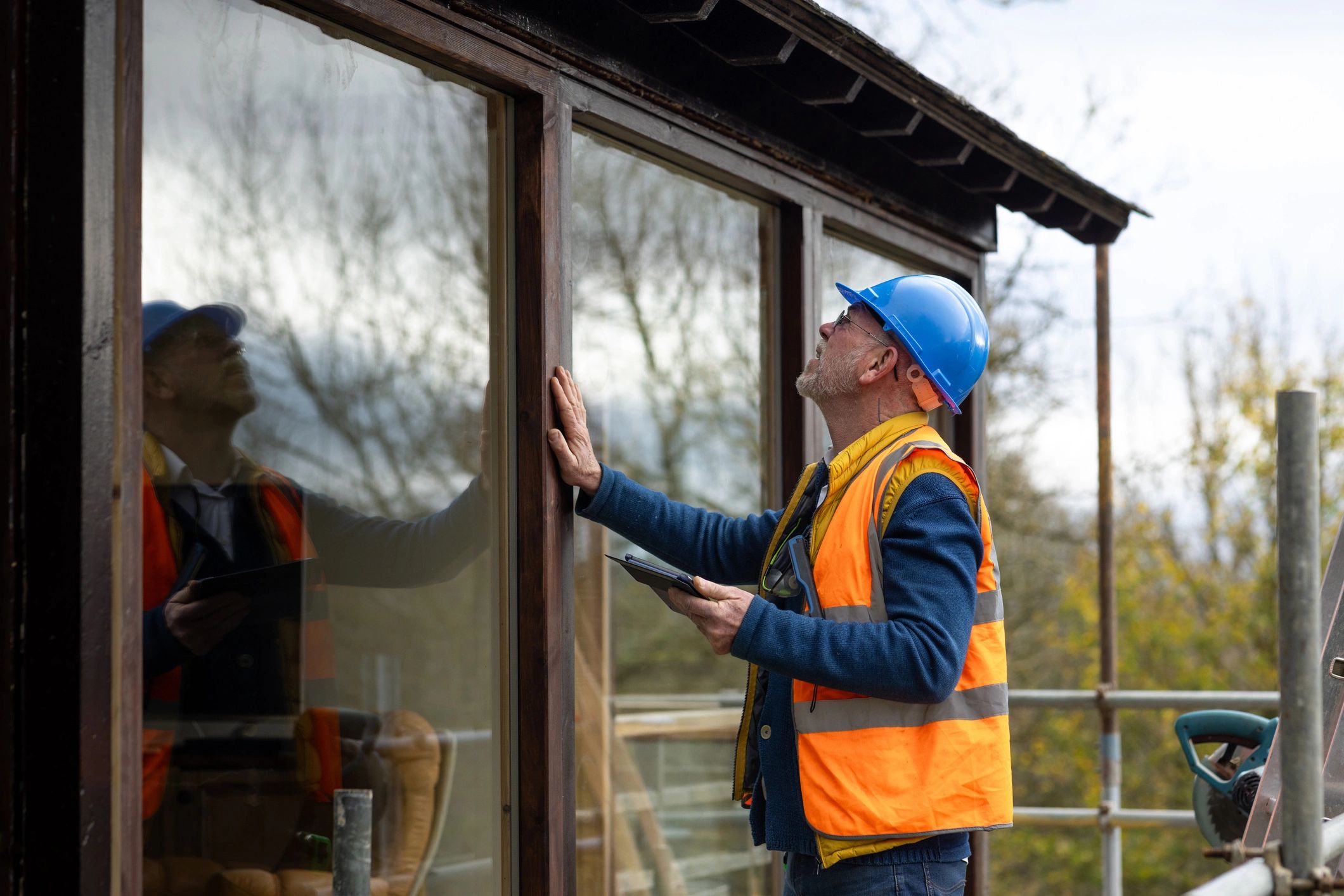 Building manager inspecting newly fitted windows