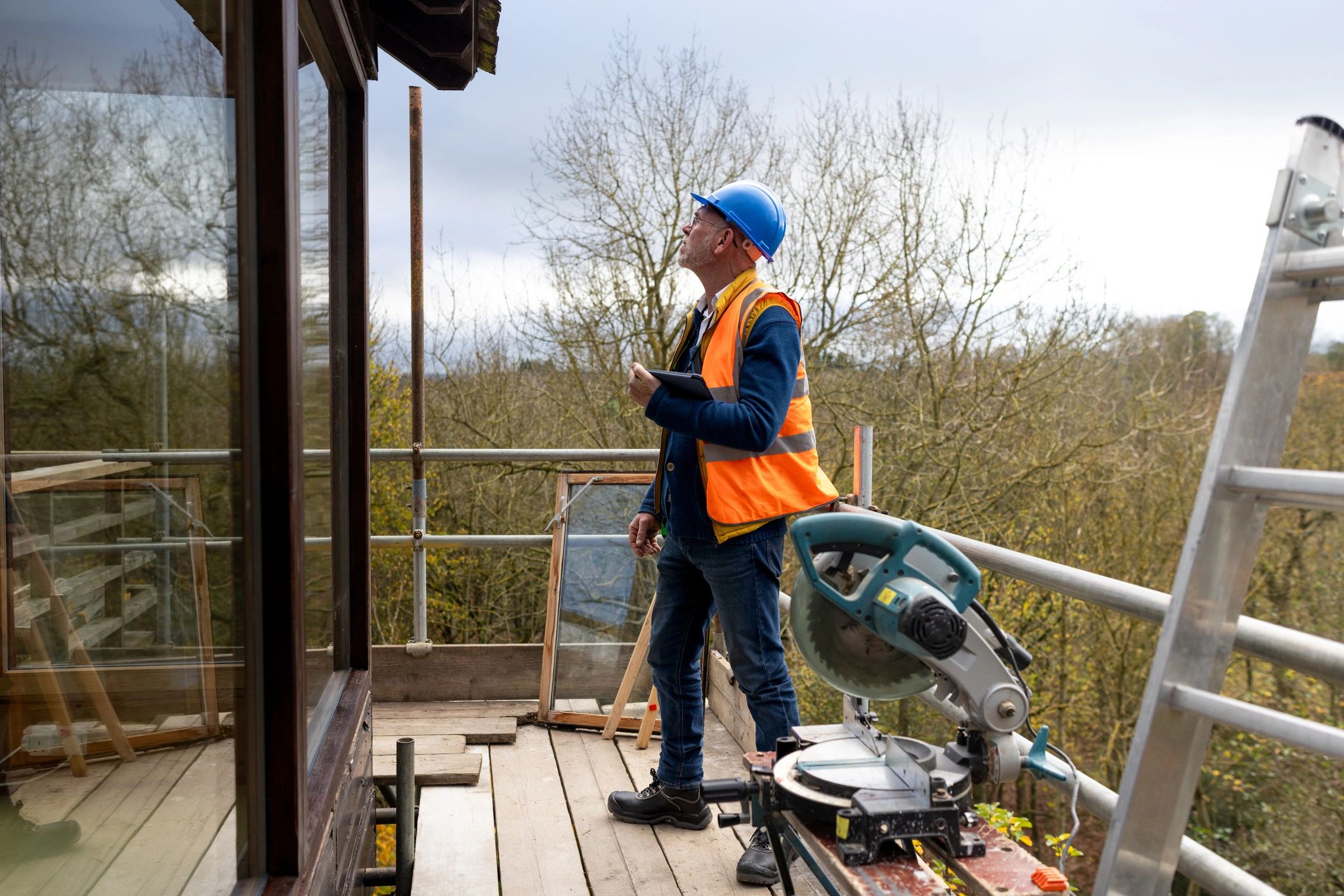 Inspector documenting site conditions for repair planning