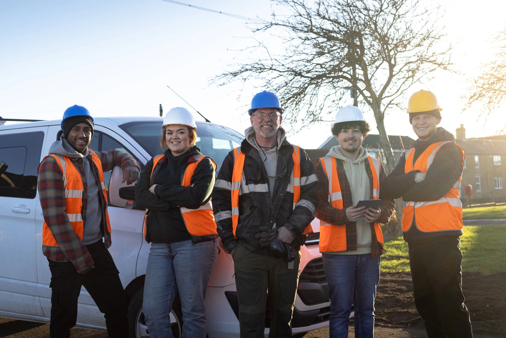 Construction team standing together at a job site