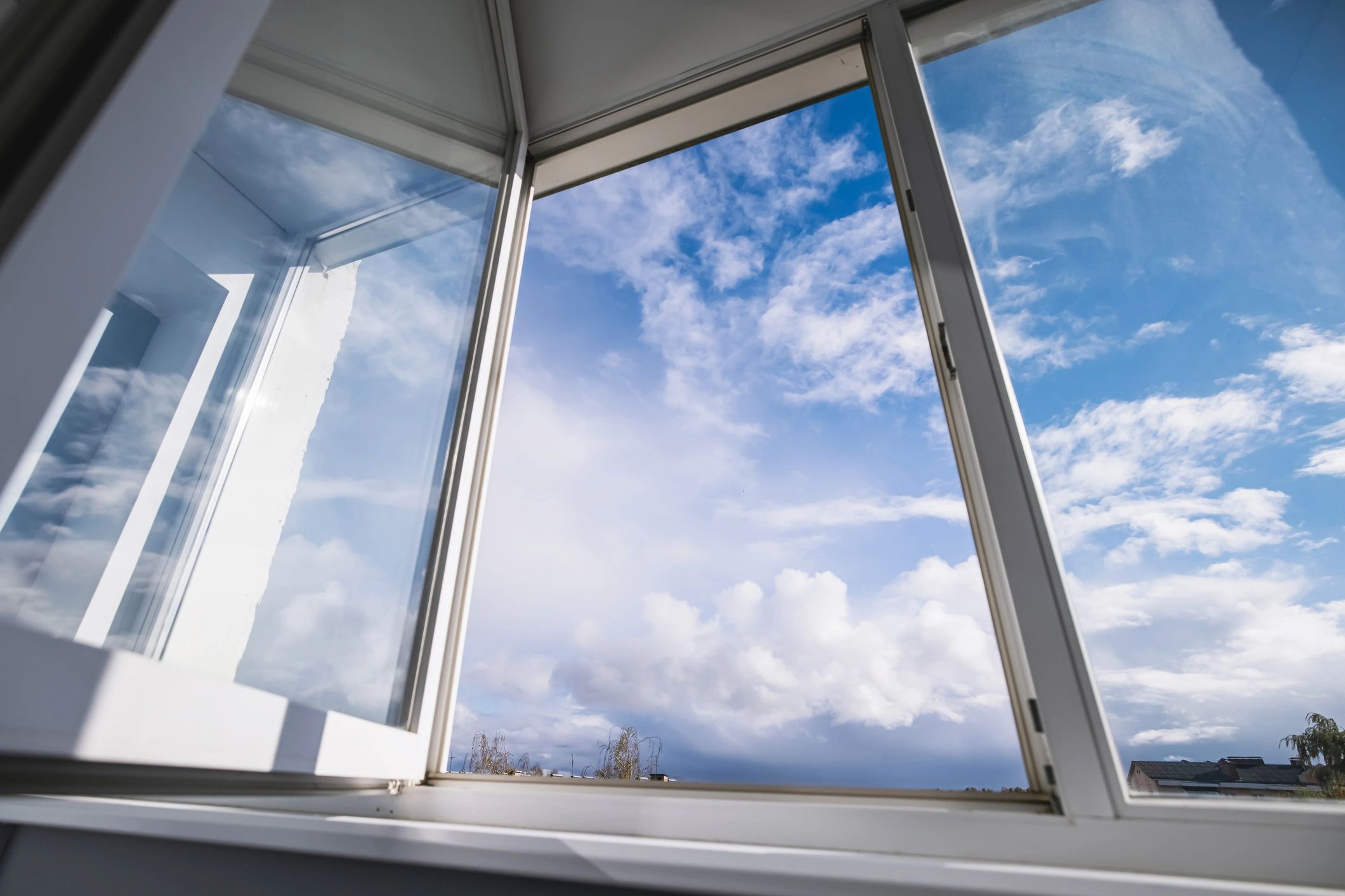 Open window and glass detail representing custom mirror and glass services