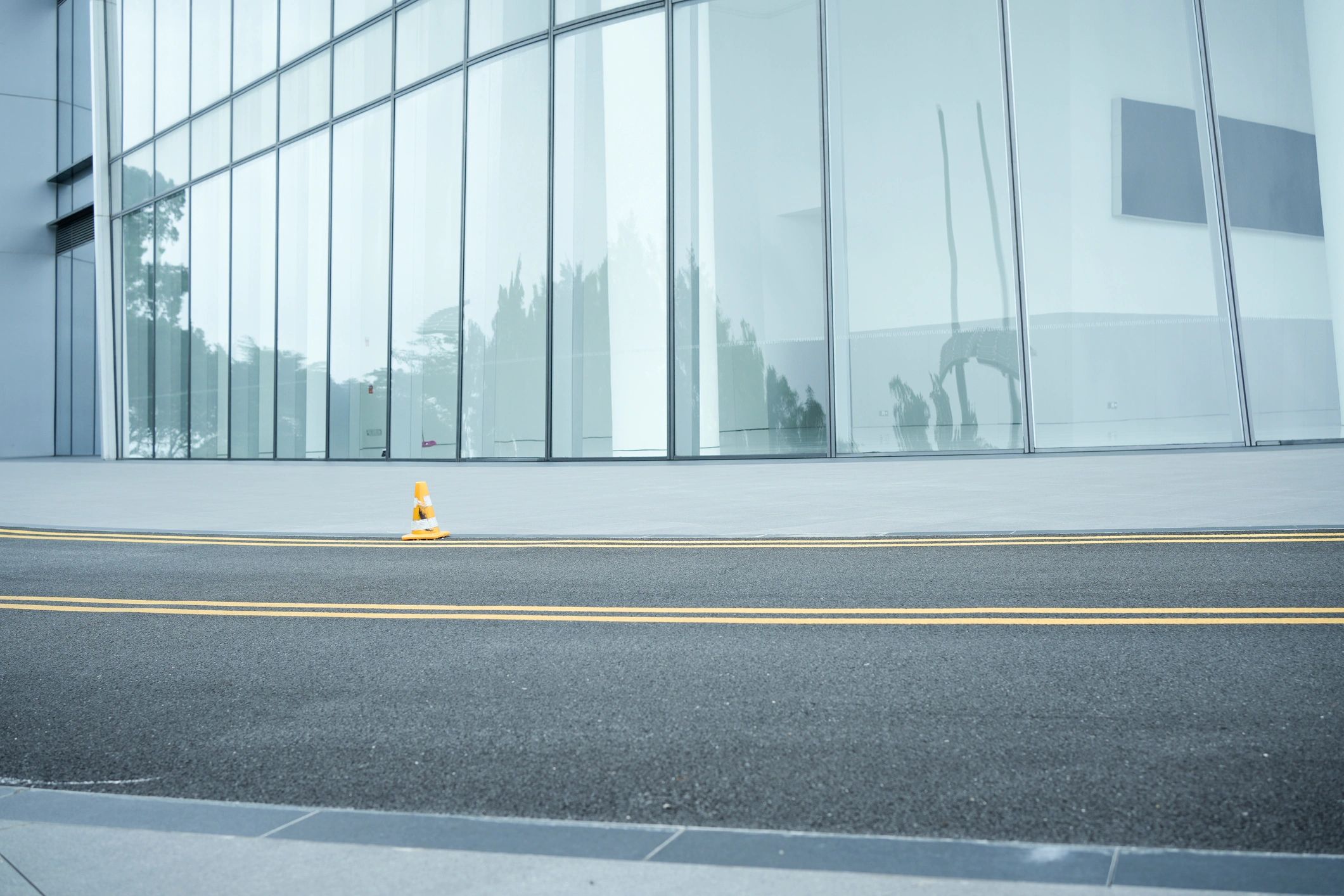 Commercial entrance with full-height glass facade